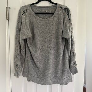 Francesca’s Grey sweater with cross cross derail on sleeve